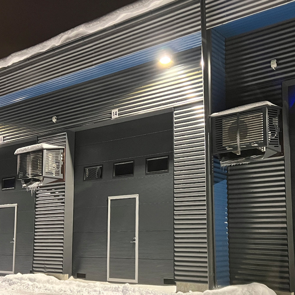 Ilmalämpöpumpun suojakotelo ja sulatusvedenohjain